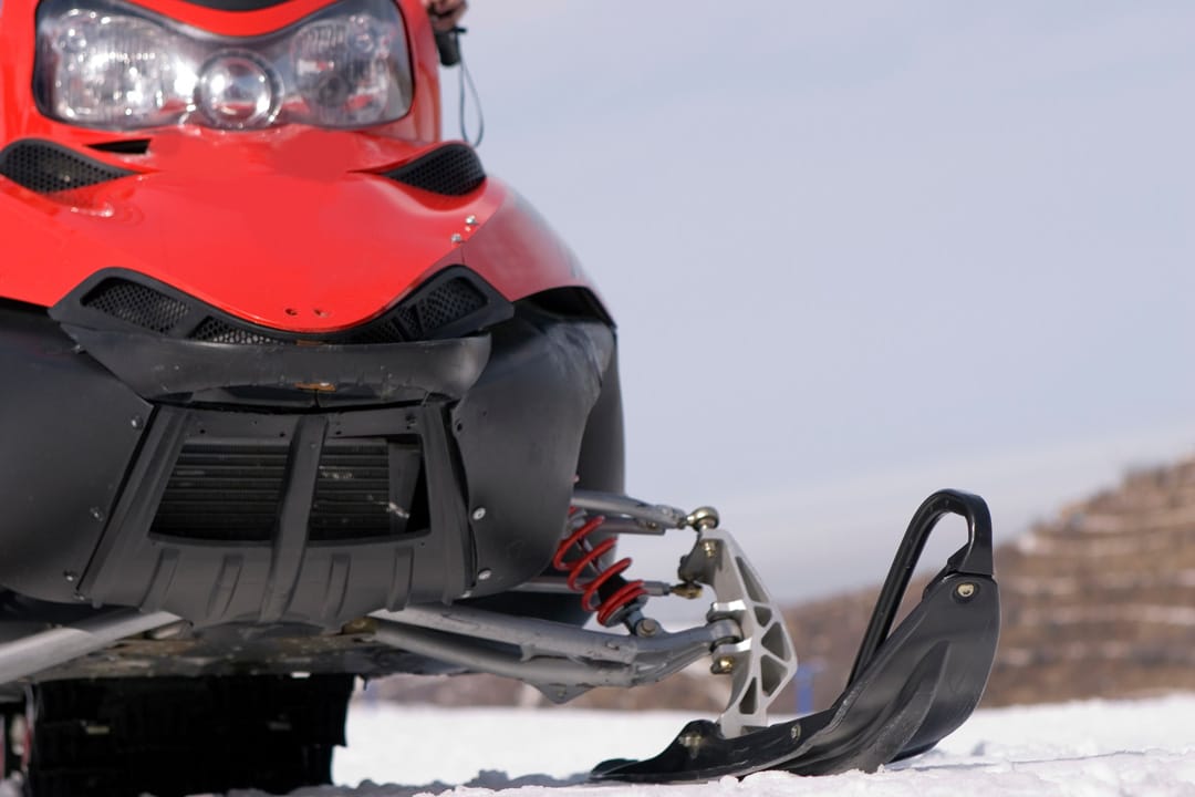 Red snowmobile with black underside