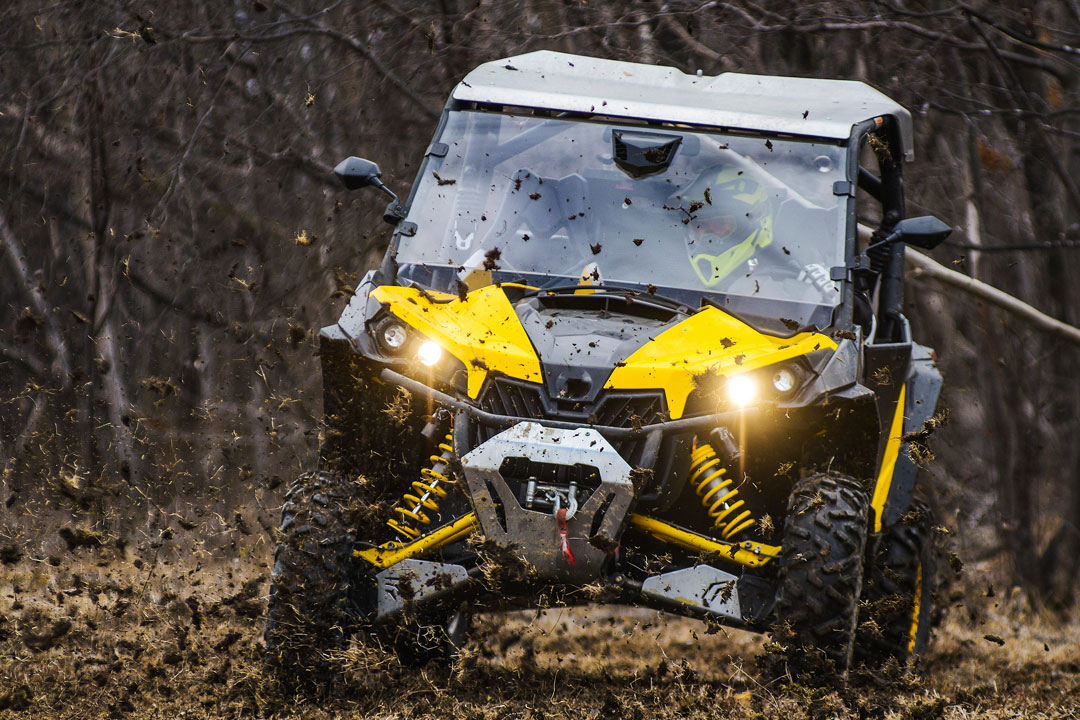 Offroad ATV driving through mud